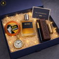 Gift set for a gentleman with BOSS perfume, clock, and other items in a decorative box.
