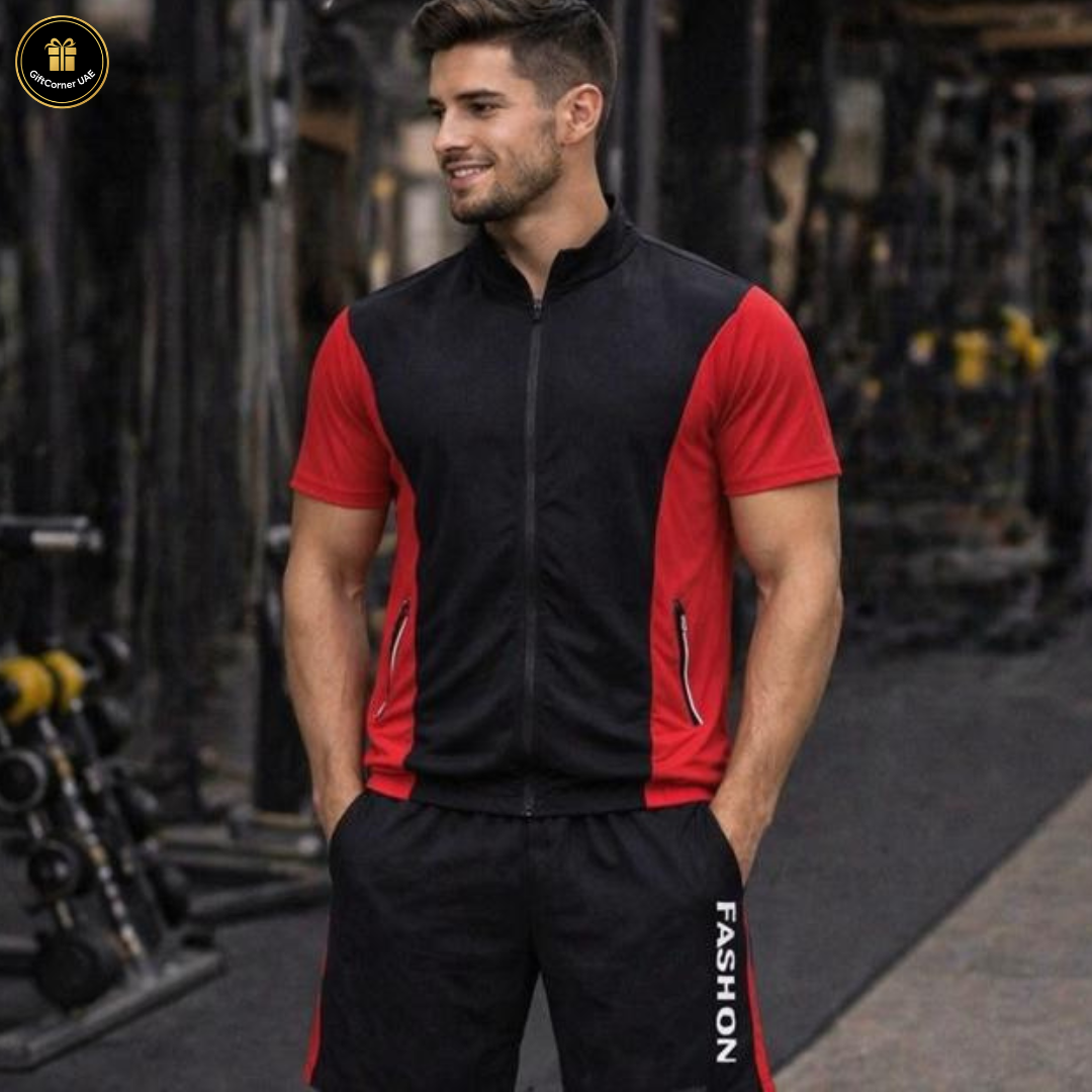 Man wearing a black and red tracksuit with 'FASHION' text in a gym setting