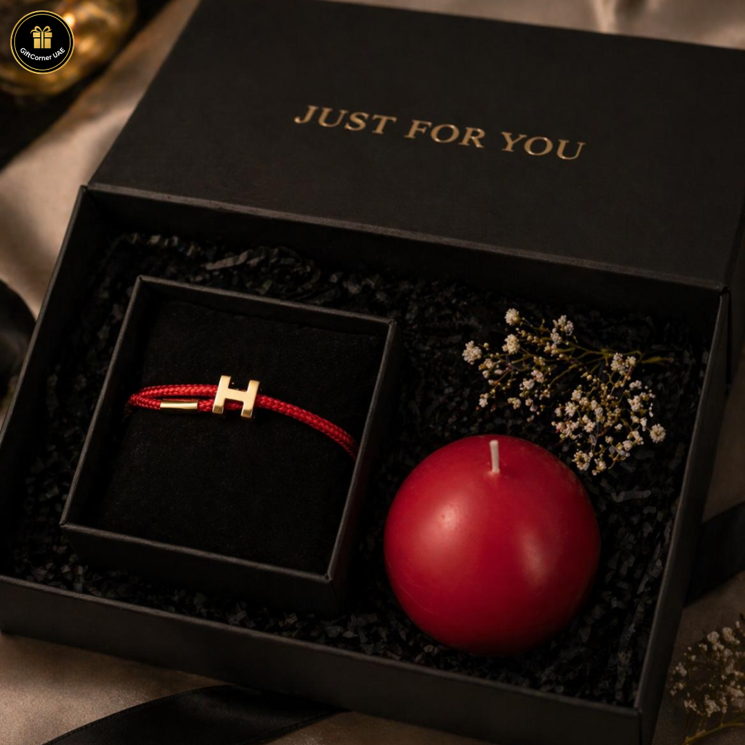 Black gift box with a red candle and red bracelet, labeled 'Just for You'.