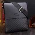 Black leather shoulder bag with woven pattern and 'POLO' branding on a wooden surface.