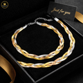 Braided gold and silver necklace in a black box with 'Just for you' card.