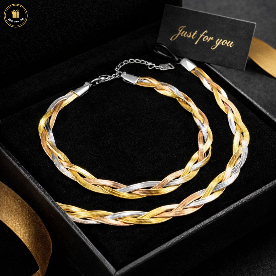 Braided gold and silver necklace in a black box with 'Just for you' card.