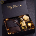 Gift set for 'My Man' with a bottle of Guess cologne, a rose, and a candle in a decorative box.