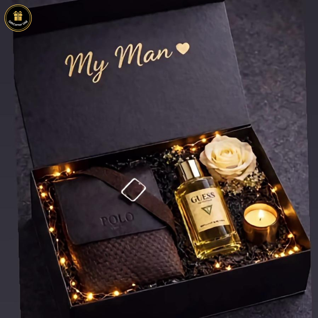 Gift set for 'My Man' with a bottle of Guess cologne, a rose, and a candle in a decorative box.
