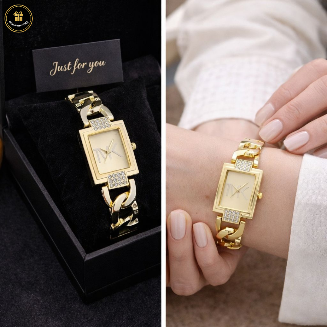 Gold watch with diamond accents in a black box and on a wrist.